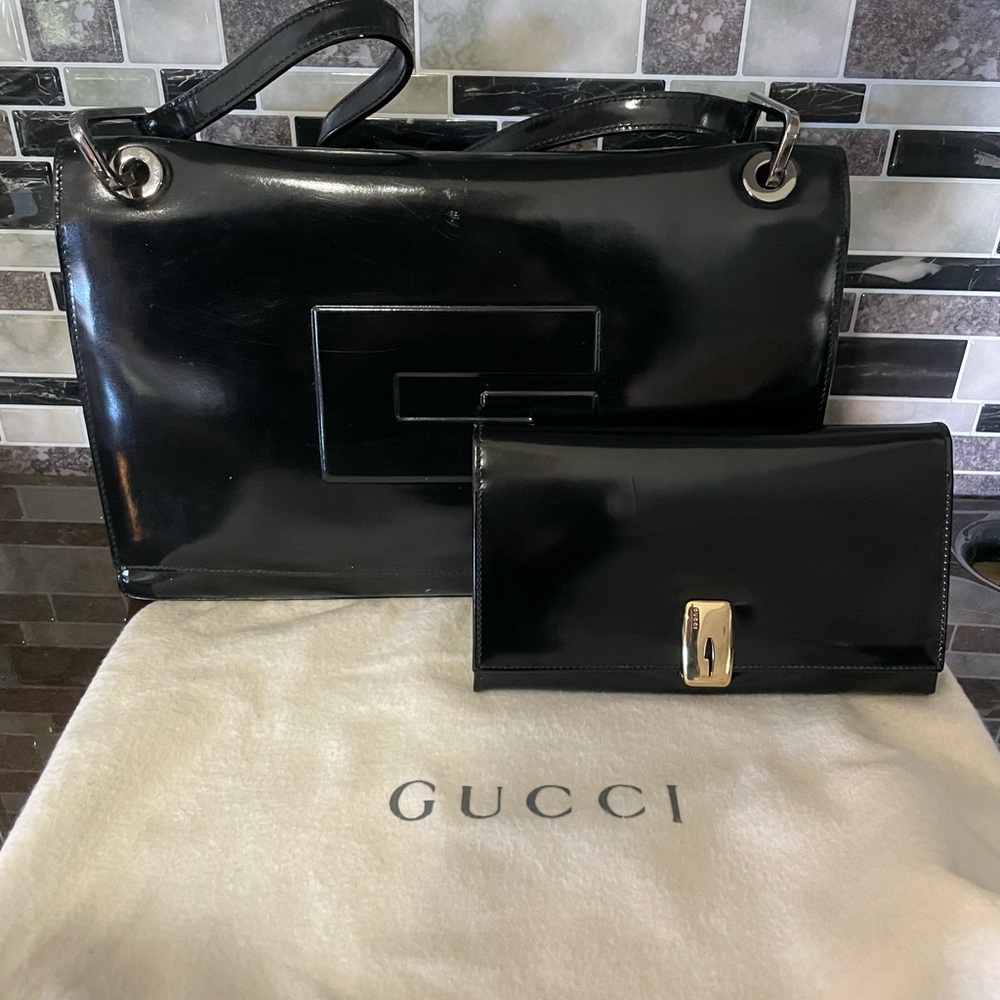 Authentic Vintage Gucci leather shoulder bag and matching wallet.